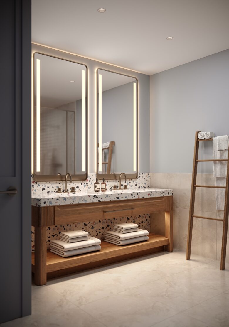Modern bathroom with a double sink vanity, large illuminated mirrors, stacked towels on shelves, and a wooden towel ladder against a light-colored wall.