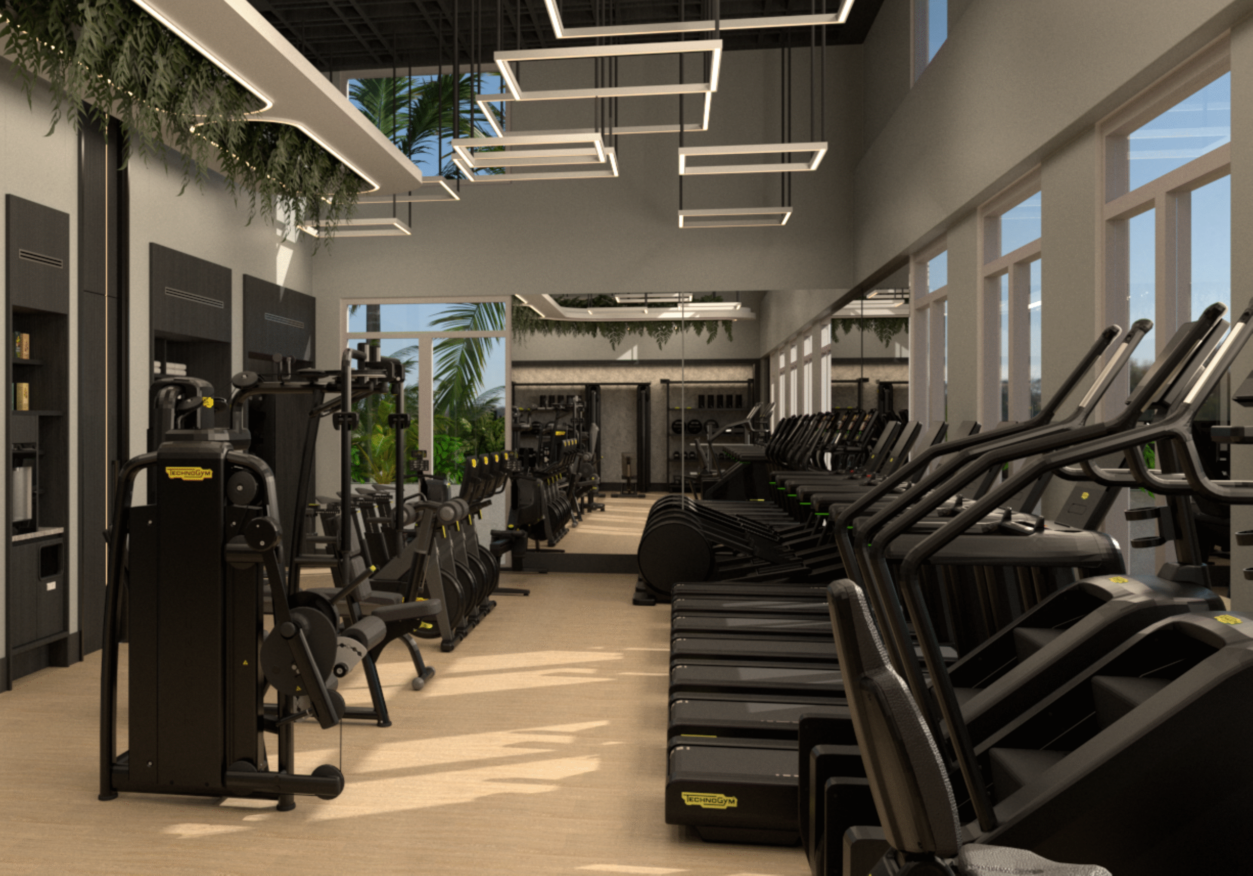Modern gym interior with rows of treadmills on the right, strength training machines on the left, large mirrors on the back wall, and natural light streaming in through tall windows. Ceiling lights and greenery add to the decor.