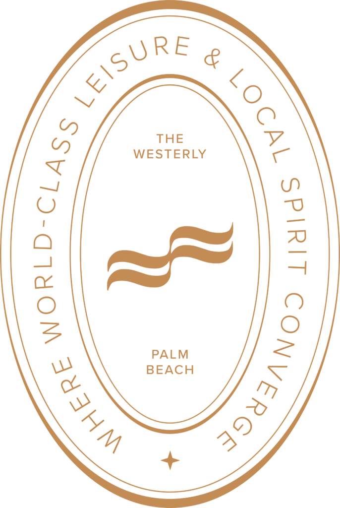 A gold oval logo with two wavy lines in the center. Text reads “The Westerly Palm Beach” and around the edge, “Where world-class leisure & local spirit converge.”.