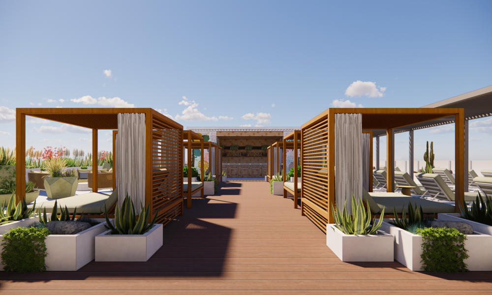 A rooftop lounge with wooden cabanas, lounge chairs, potted plants, and a bar at the far end, under a clear blue sky with scattered clouds.